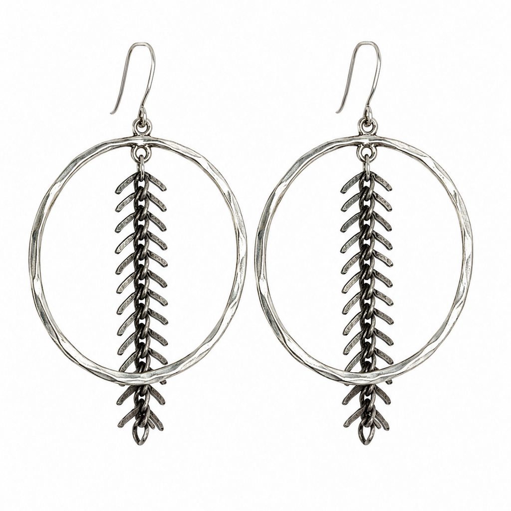 A pair of silver-toned dangle earrings featuring a hammered oval hoop with a textured vertical chevron or feather-like drop hanging from the center, suspended from fishhook wires, shown against a plain white background.