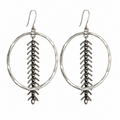 A pair of silver-toned dangle earrings featuring a hammered oval hoop with a textured vertical chevron or feather-like drop hanging from the center, suspended from fishhook wires, shown against a plain white background.