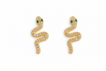 Gold snake-shaped earring with green gemstones on a white background