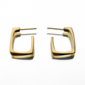 Gold hoop earrings on a white background